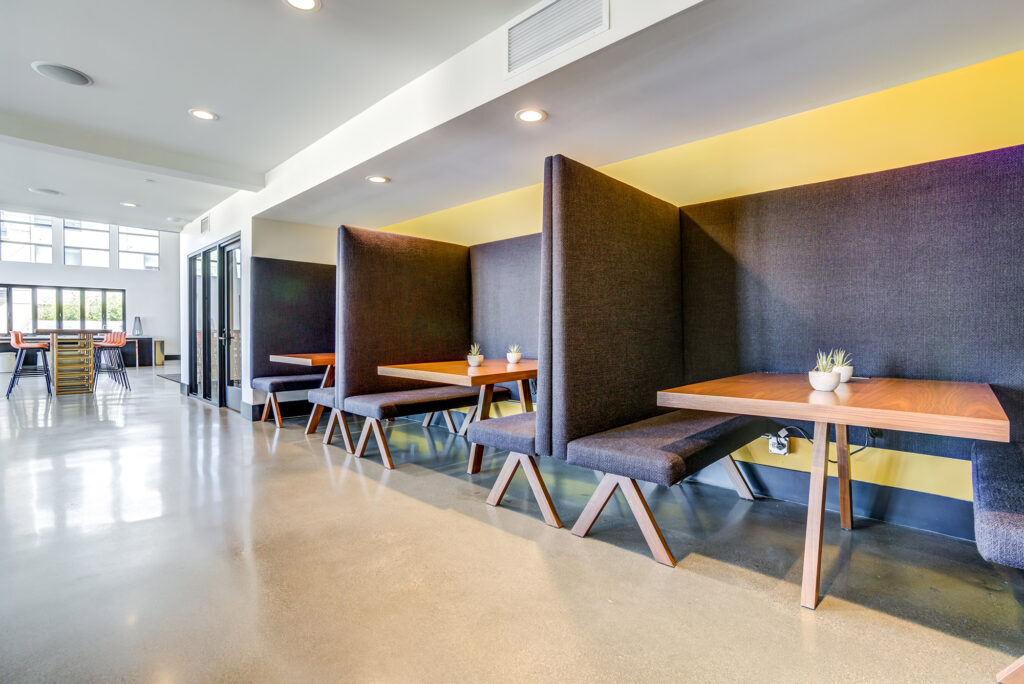 Seating alcoves with wooden tables and bench seating.