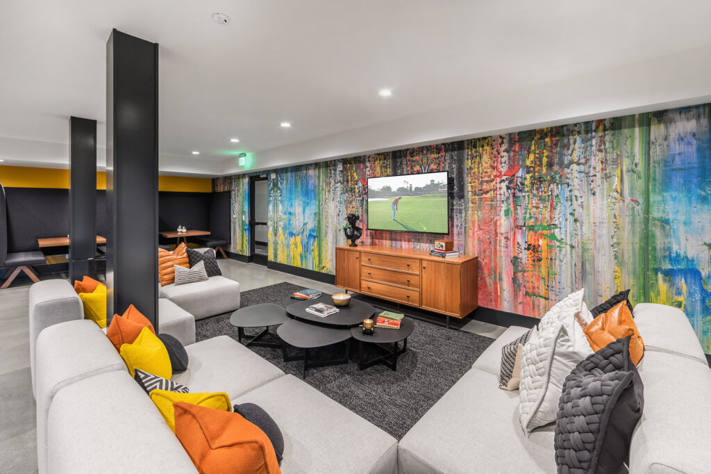 Lobby entrance with modern furniture, coffee station and mail room.